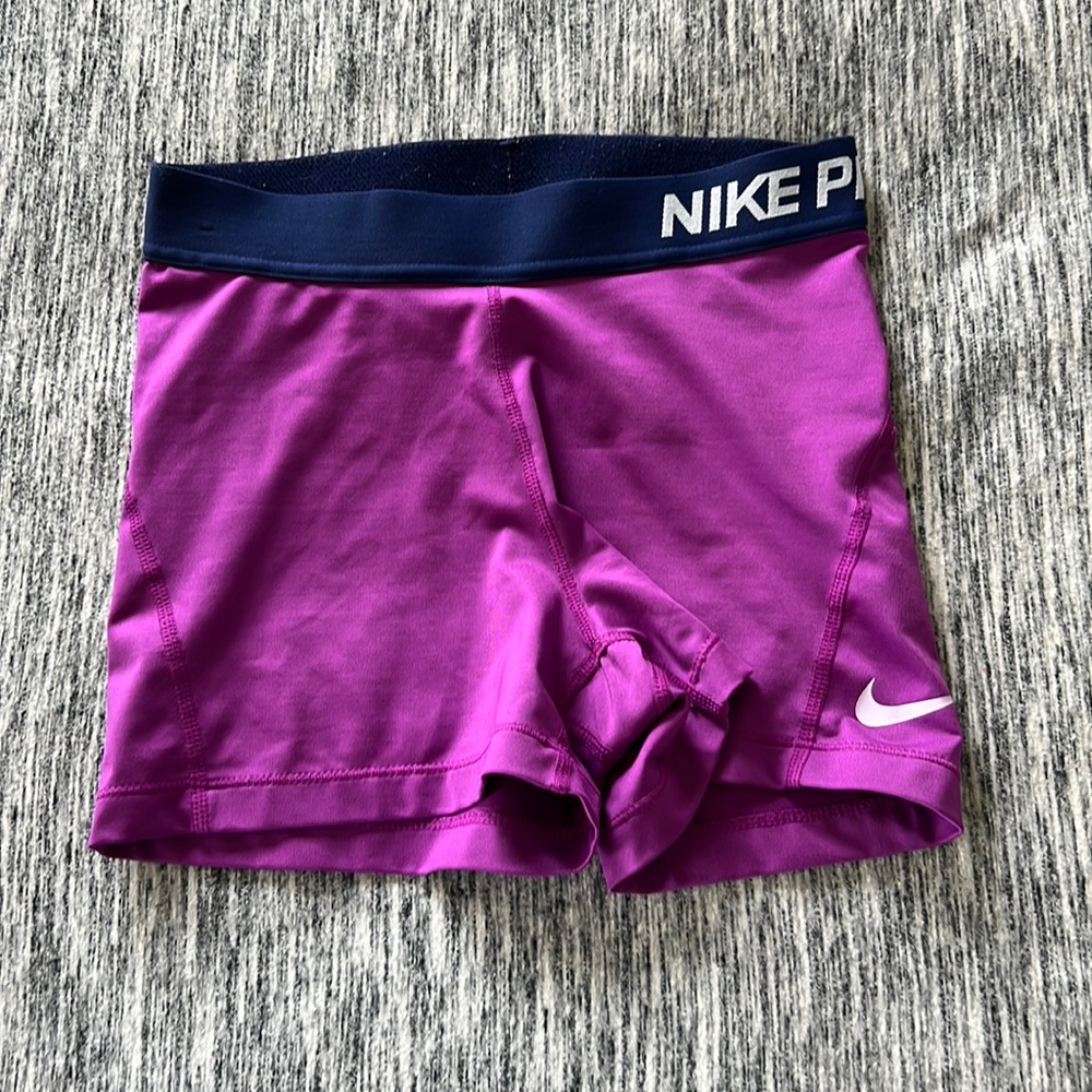 selling bc they don’t fit anymore. size Small, Nike brand, and they’re purple.